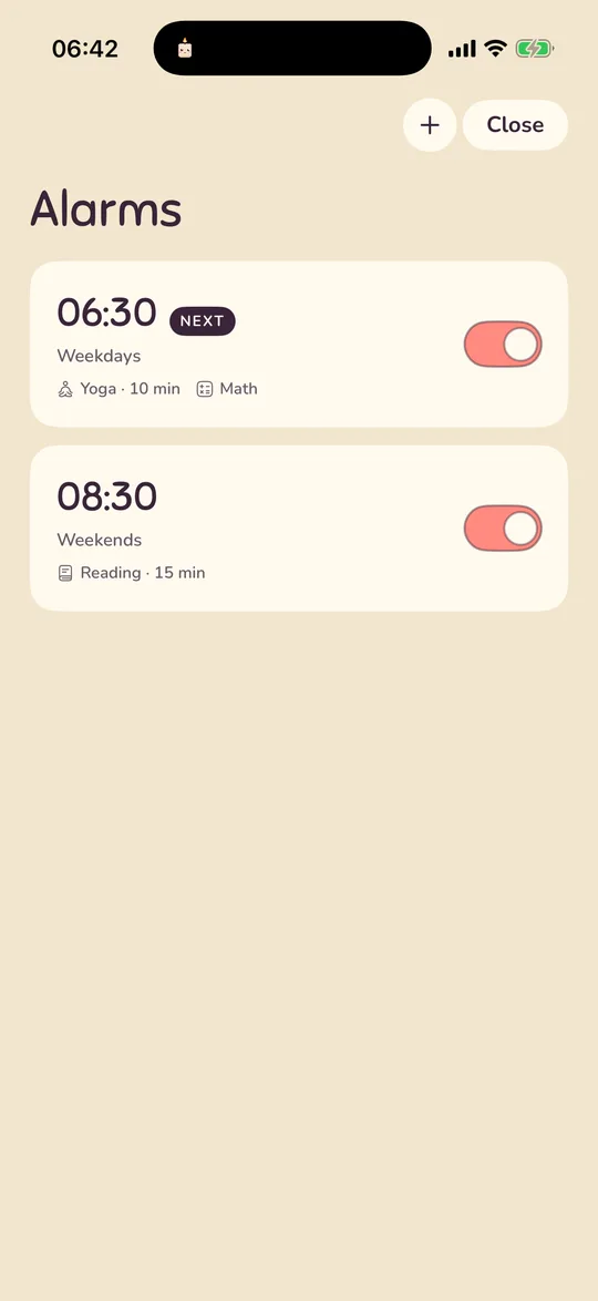 The alarm list with two alarms: 06:30 on weekdays with yoga and a maths mission, and 08:30 at weekends with reading