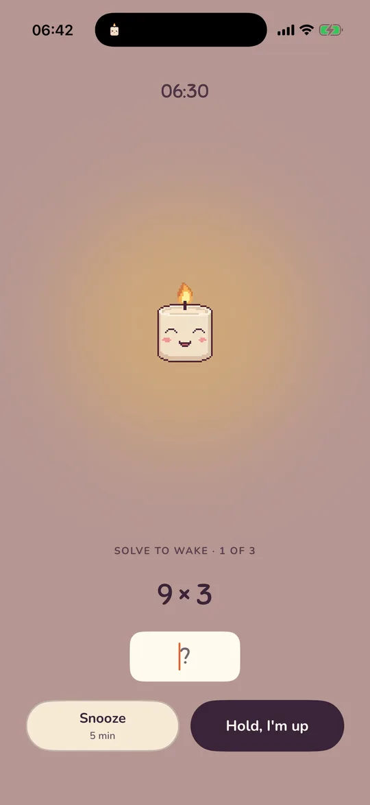 Wick's wake screen after tapping I'm up, with a maths mission and the Snooze and Hold, I'm up buttons